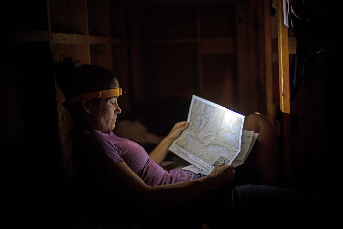 Reading a map with a headlamp while bikepacking